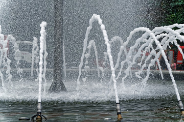 Close-up fountain in Kyiv, fresh spring day, flowing water