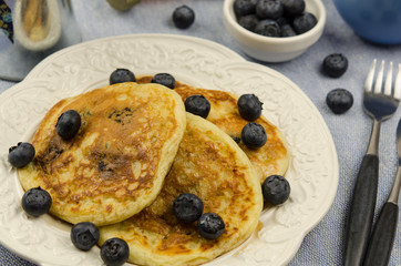 Delicious homemade pancakes with fresh blueberry and maple syrup