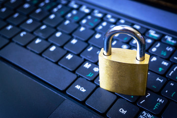 Golden Padlock on Keyboard Cyber Security Concept With Copy Space