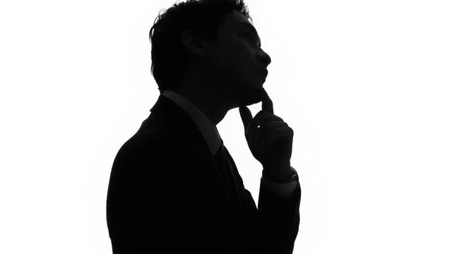 Silhouette of thinking man.