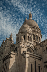 Fototapeta na wymiar Close-up of domes and decoration at the Basilica of Sacre Coeur facade in Paris. Known as the “City of Light”, is one of the most impressive world’s cultural center. Northern France.