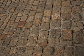 Close-up of street pavement made of stone blocks in Paris. Known as the “City of Light”, is one of the most awesome world’s cultural center. Northern France