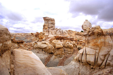 Pocked and weathered sandstone hoodoo formation in the Bisti Badlands desert of North West New Mexico.
