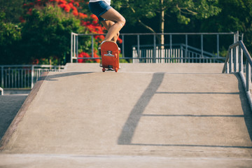 skateboarder skateboarding on skatepark ramp