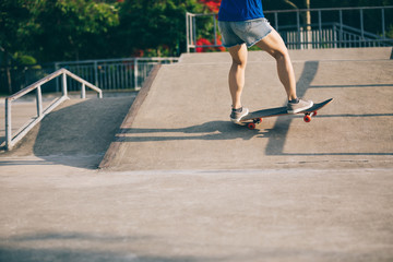 skateboarder skateboarding on skatepark ramp