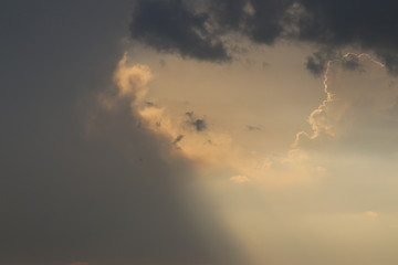 Naklejka na ściany i meble Overcast sky with clouds and gleams