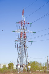 Support high-voltage power lines, close-up. blue sky without clouds. Electrical industry.