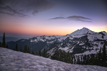 Mt. Baker at sunset with snow pack and blue red sky