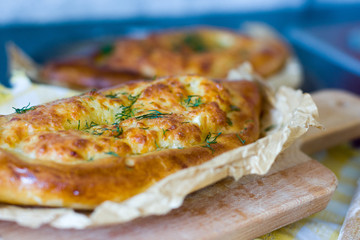 Georgian Khachapuri according to Adjarian close-up. Fresh traditional pastries.