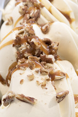 Vanilla ice cream with caramel sauce and walnuts