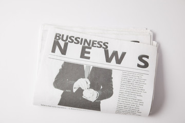 one business newspaper lying on white background