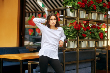 Portrait of a young woman in the city .Women's casual clothes .