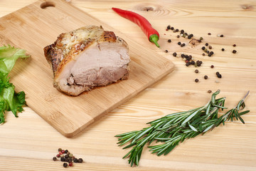 baked pork with salad and spices