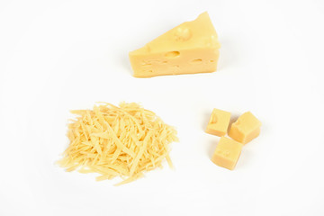 piece of cheese and heap of grated cheese, isolated on white background.