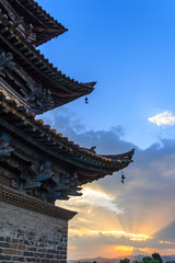 Fototapeta premium Traditional Chinese building with blue sky and sunset in the background