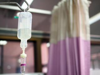 Saline solution bag hag in hospital room