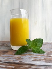 Low angle shot of glass of orange juice