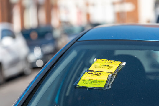 Penalty Charge Notice On Car Windscreen Parked On British Road In England