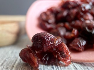 Cranberries spilling from pink scoop