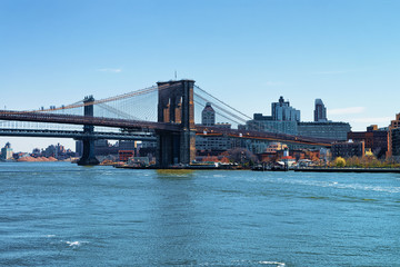 Fototapeta na wymiar Brooklyn bridge and Manhattan bridge above East River