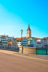 Naklejka premium Limmat quay with St Peter clock tower Zurich