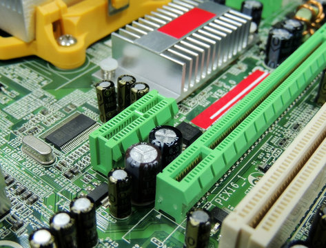 Soldered radio components on computer circuit board close up 