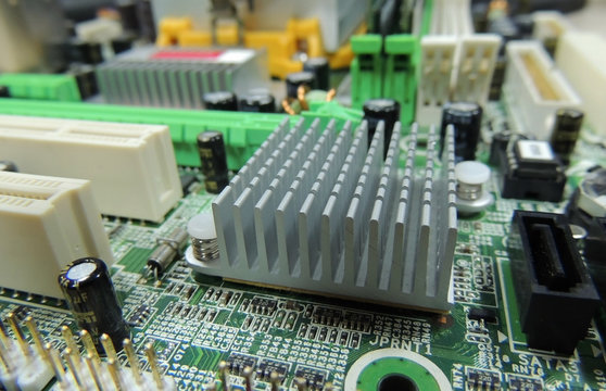 Soldered radio components on computer circuit board close up