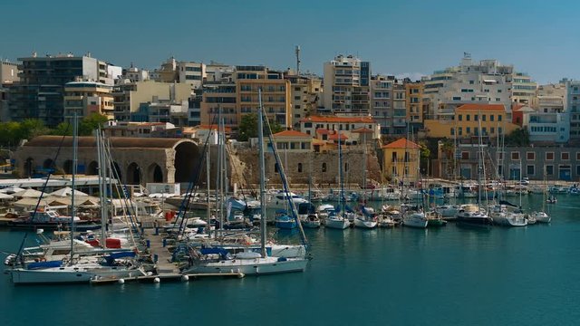 Close-up establishing shot of the port of Heraklion and Venetian shipyards in the Greek island of Crete