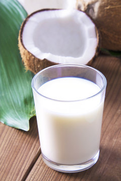 glass of coconut milk with wooden background