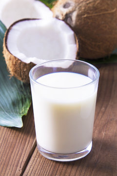glass of coconut milk with wooden background