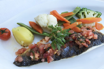 Fried fish with vegetables. Macro. Healthy food.