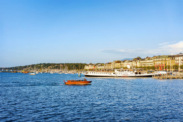 Fototapeta na wymiar Boats on the Geneva Lake at Promenade du Lac in summer