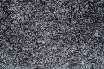 Fototapeta na wymiar Black cracked cement texture background.