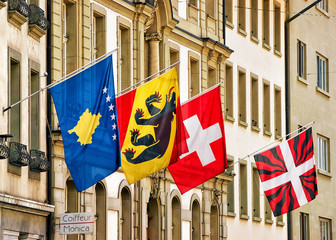 Swiss Flags waving in the street at city center Bern