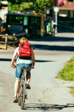 Person riding a bicycle in resort city summerSwitzerland