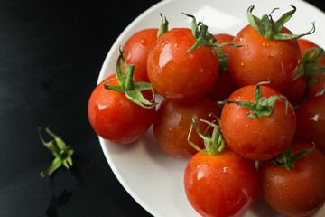 close up fresh tomato on black table  background.