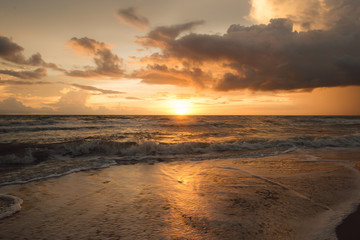 Sunset on the beach with beautiful sky . Sunrise on the beach .