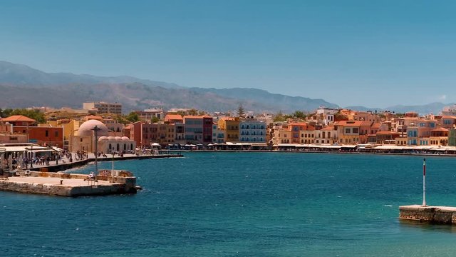 Amazing tracking shot of the promenade, coast and Old Town of Chania, Crete, Greece