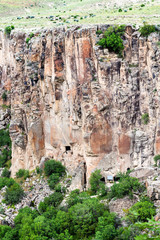 Fototapeta na wymiar rocky slope of Ihlara Valley in Cappadocia
