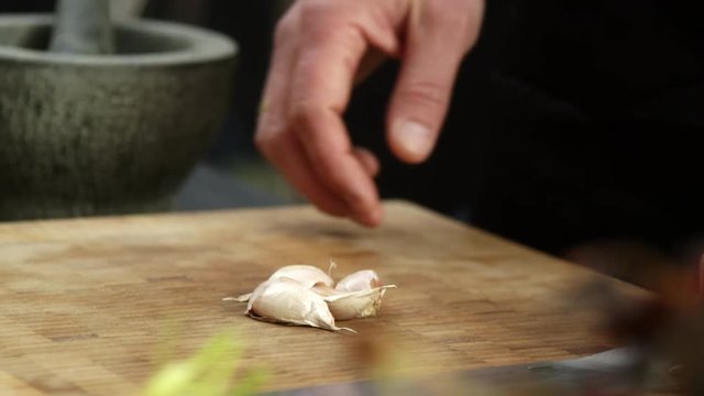Chef preparing garlic