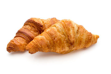 Tasty buttery croissants on the white background.
