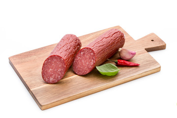 Salami smoked sausage, basil leaves on white background cutout.