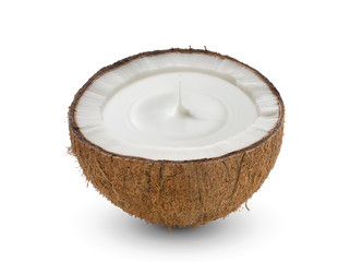 Cracked half of tropical fruit, Coconut with milk droplet on white background