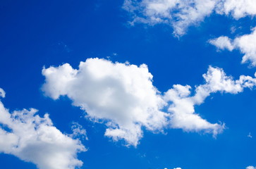 Obraz na płótnie Canvas Bright blue cloudy sky as a background.