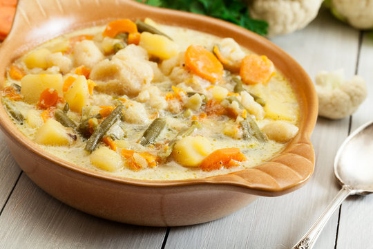 Vegetable soup with ingredients carrot, cauliflower, potato and