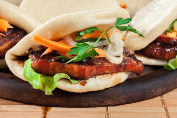 Gua bao, steamed buns with pork belly and vegetable