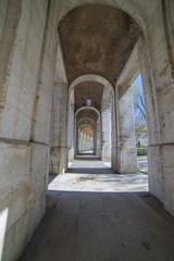Obraz premium Ancient, Passage Old arcs, architecture. A sight of the palace of Aranjuez (a museum nowadays), monument of the 18th century, royal residence Spain.