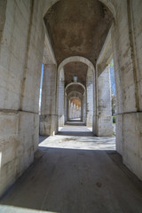 Fototapeta premium Passage Old arcs, architecture. A sight of the palace of Aranjuez (a museum nowadays), monument of the 18th century, royal residence Spain.