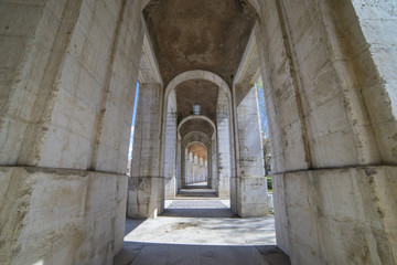 Passage Old arcs, architecture. A sight of the palace of Aranjuez (a museum nowadays), monument of the 18th century, royal residence Spain.