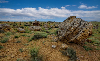 Shirkala. West Kazakhstan. In the boundless steppe around the famous mount Shirkala scattered huge picturesque stone balls-nodules.